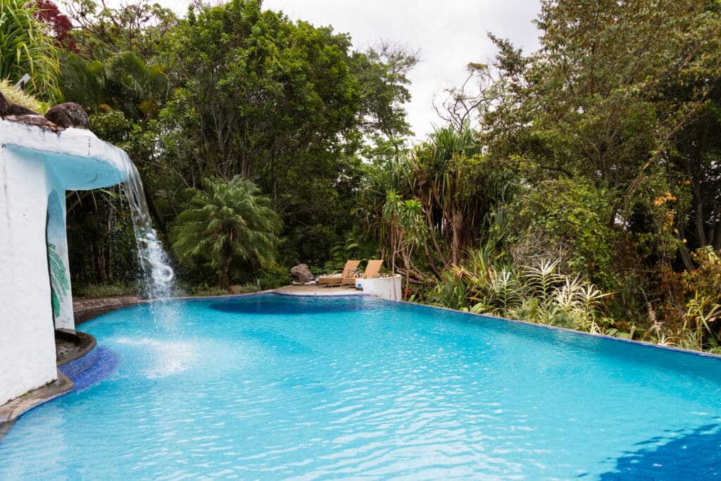 relaxing swimming pool with a waterfall in a tropi 2026 01 11 10 27 55 utc